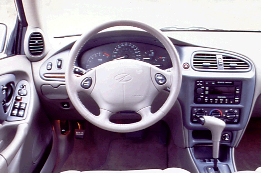 thumbnail image 2 of Left Side Stick-On Mirror Glass For Chevy Malibu 97-05, Olds Cutlass 97-99 - Chrome Flat Glass 2 of 5