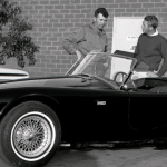 Carroll Shelby (left) and Steve McQueen discuss the Cobra.
