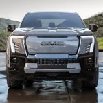 Bold and modern grille of the GMC Sierra EV Denali Edition 1 from a front view.