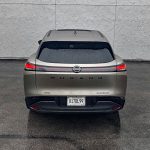 2025 Nissan Murano Platinum in Champagne Silver, rear view, taillights on, rain,
